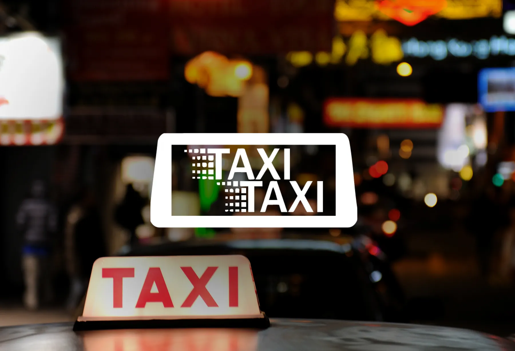 Taxi-Taxi-Logo über einer nächtlichen Straßenszene